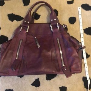 Beautiful plum colored Italian leather hand bag